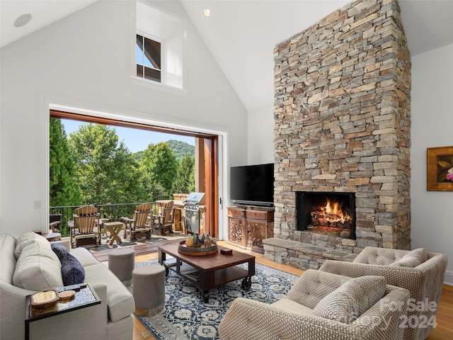 4 Windelsham Way, Arden, NC 28704 - living room featuring high vaulted ceiling, a wealth of natural light, light hardwood / wood-style floors, and a fireplace