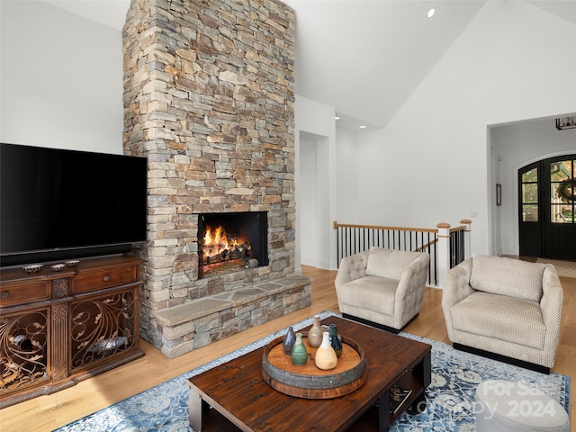 4 Windelsham Way, Arden, NC 28704 - living room featuring light wood-type flooring, a fireplace, and high vaulted ceiling