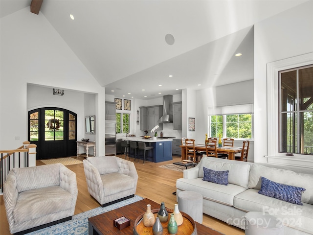 4 Windelsham Way, Arden, NC 28704 - living room with high vaulted ceiling, light hardwood / wood-style floors, a healthy amount of sunlight, and beam ceiling