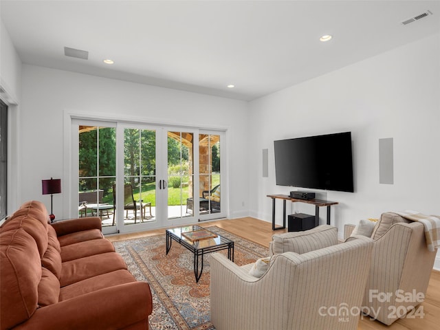 4 Windelsham Way, Arden, NC 28704 - living room featuring light wood-style flooring, recessed lighting, baseboards, and french doors