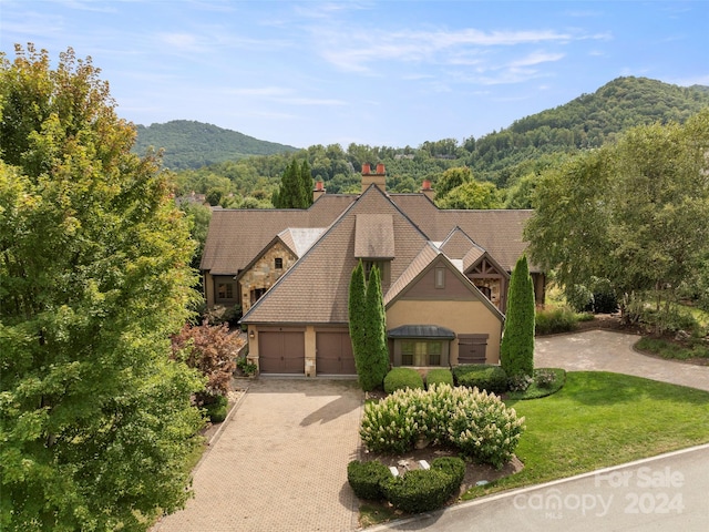 4 Windelsham Way, Arden, NC 28704 - view of front of property featuring a garage, a mountain view, and a front yard