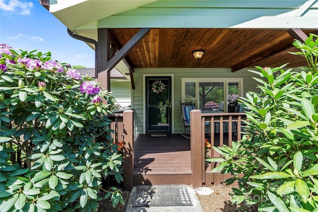 property entrance with a wooden deck