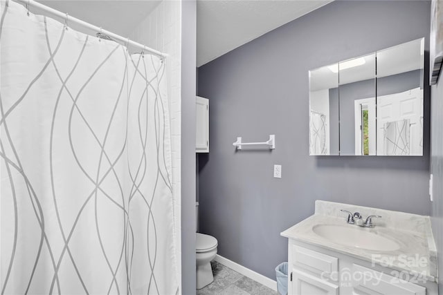 bathroom with vanity, toilet, and a shower with curtain