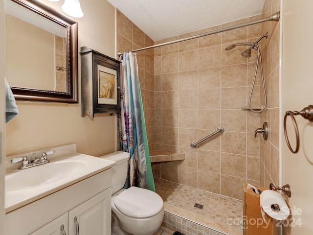 bathroom featuring vanity, walk in shower, a textured ceiling, tile patterned flooring, and toilet