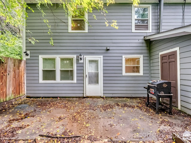 rear view of property featuring a patio area