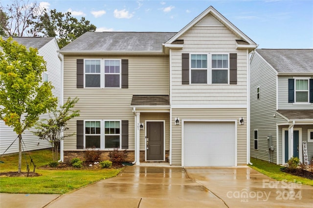 view of front of property with a garage