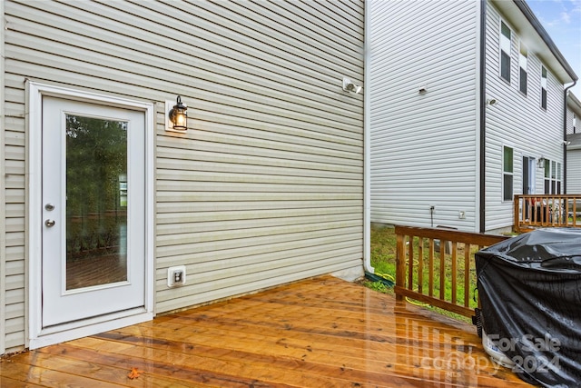 wooden deck with grilling area