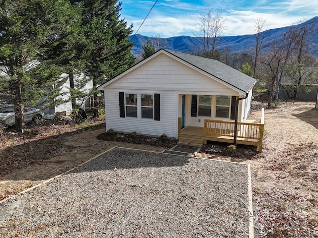 view of front of house with a deck with mountain view