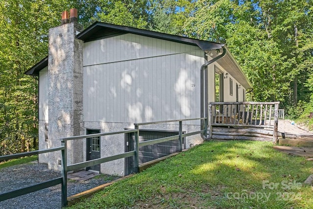 view of outbuilding featuring a yard