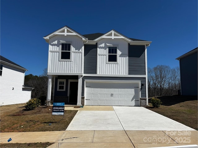 view of front of house featuring board and batten siding, an attached garage, and concrete driveway