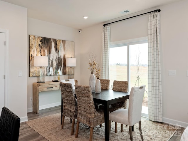 dining area featuring visible vents, recessed lighting, wood finished floors, and baseboards