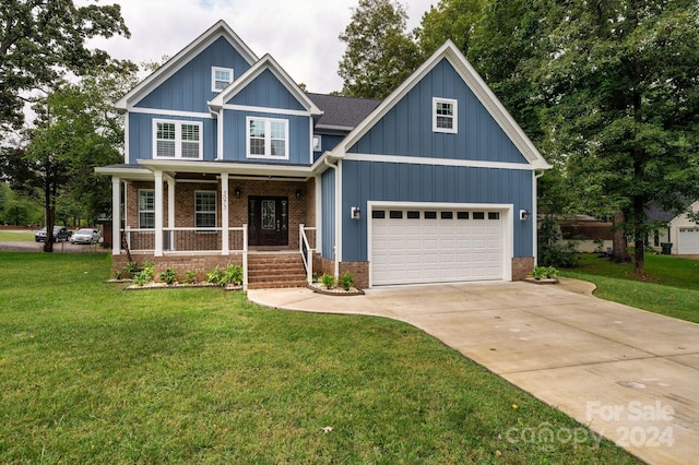 craftsman-style home with a garage, a front lawn, and covered porch