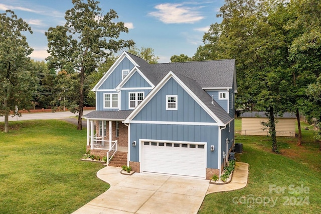 craftsman-style home featuring a garage and a front lawn