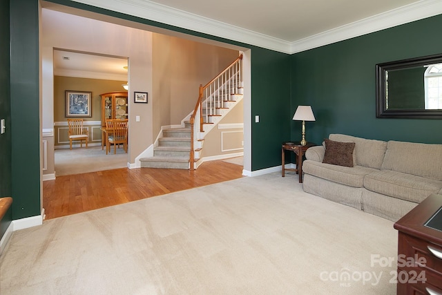 living room featuring ornamental molding and wood-type flooring