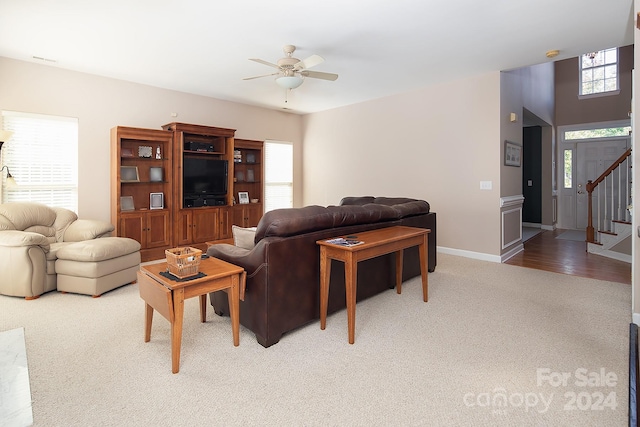 living room with ceiling fan and hardwood / wood-style floors