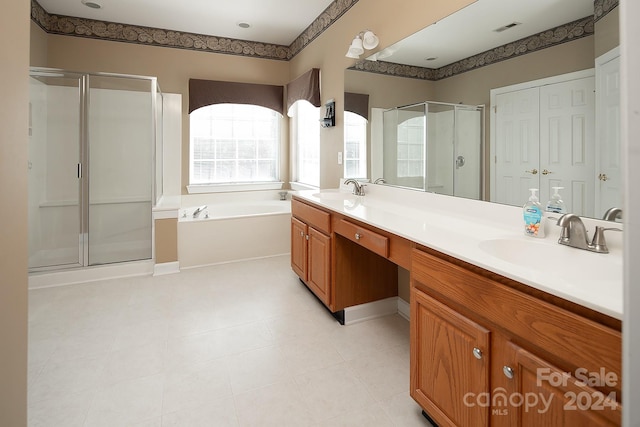 bathroom featuring vanity and shower with separate bathtub