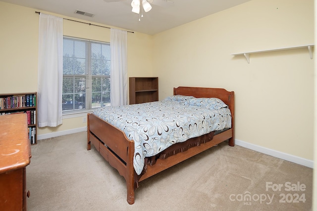 carpeted bedroom featuring ceiling fan