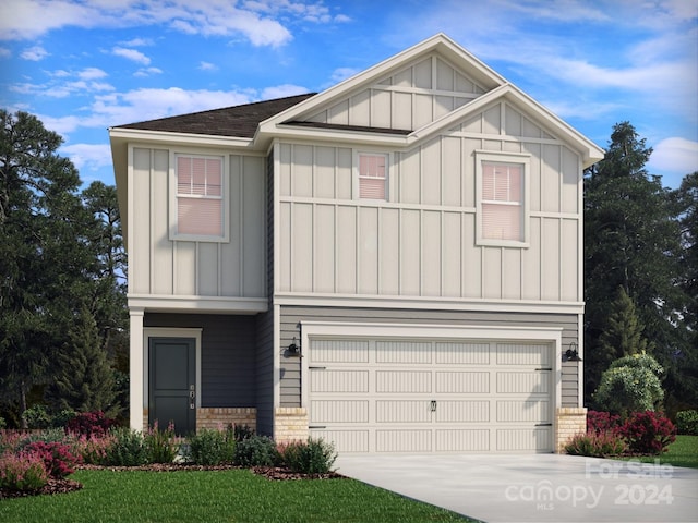 view of front of home featuring a front yard and a garage