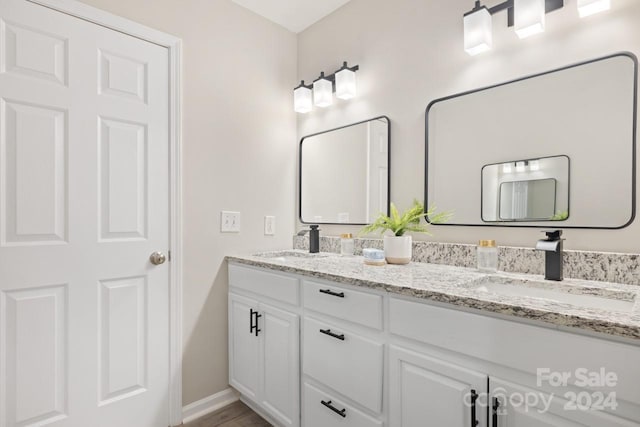 bathroom featuring vanity and hardwood / wood-style floors