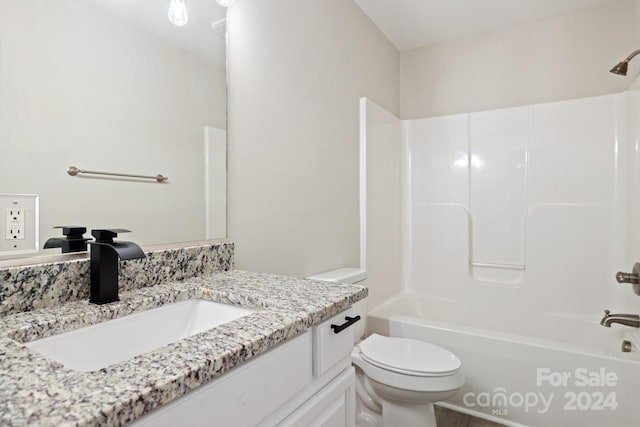 full bathroom with shower / washtub combination, vanity, and toilet