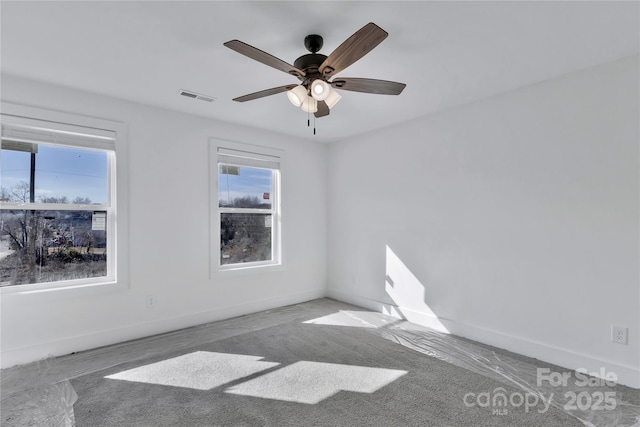 carpeted empty room with ceiling fan