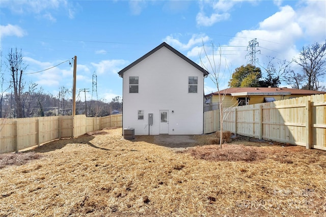 back of property featuring cooling unit