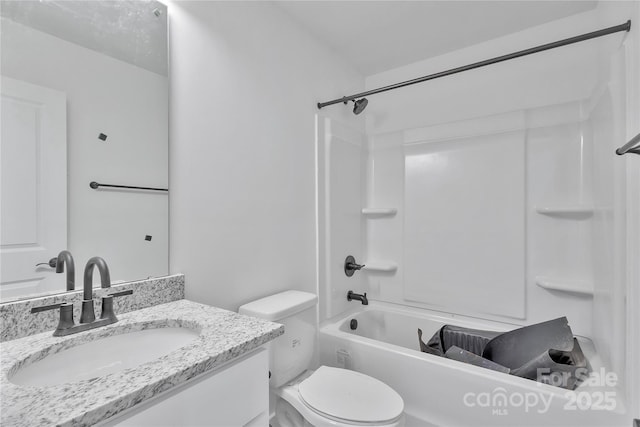 full bathroom with vanity, shower / washtub combination, and toilet