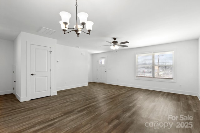 interior space featuring dark wood-type flooring and ceiling fan with notable chandelier