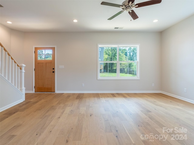 foyer entrance with ceiling fan, light hardwood / wood-style flooring, and a wealth of natural light