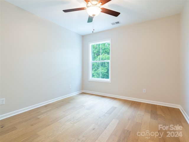 unfurnished room with ceiling fan and light hardwood / wood-style flooring