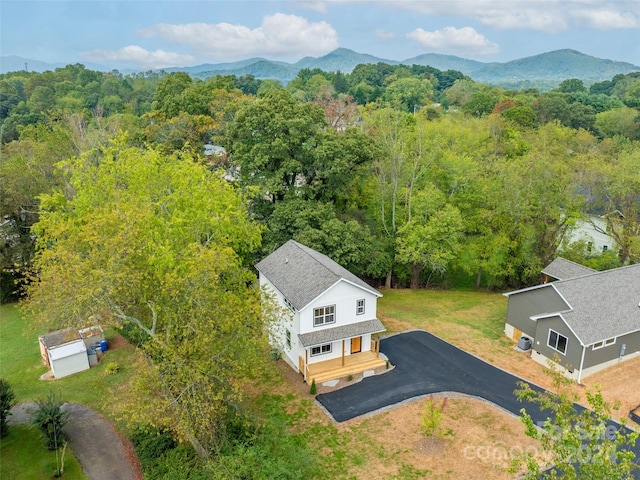 birds eye view of property with a mountain view