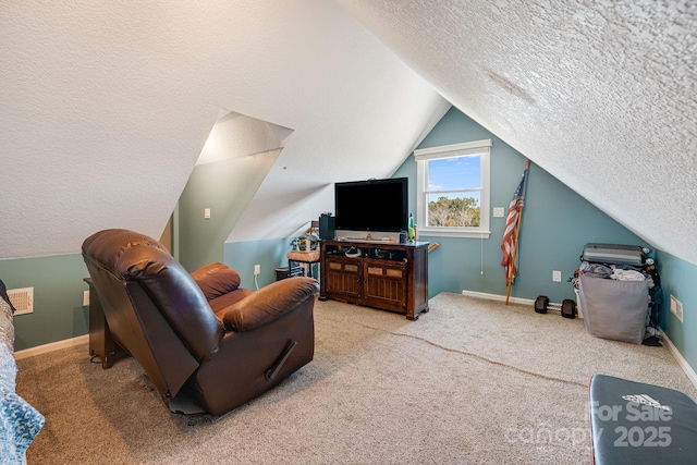 carpeted living room featuring lofted ceiling and a textured ceiling