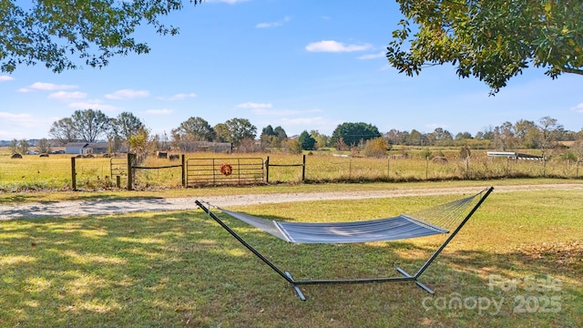 view of yard with a rural view