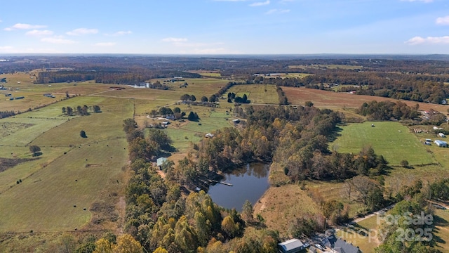 drone / aerial view with a rural view and a water view