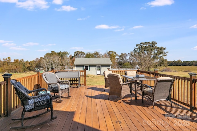 wooden deck featuring an outdoor structure