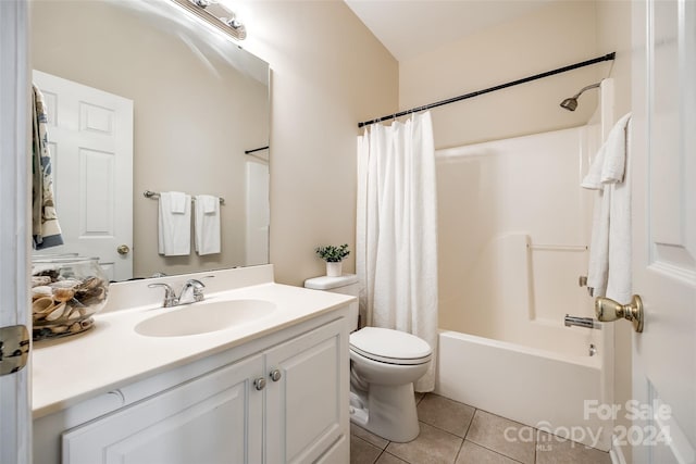 full bathroom with vanity, shower / bath combo, toilet, and tile patterned flooring