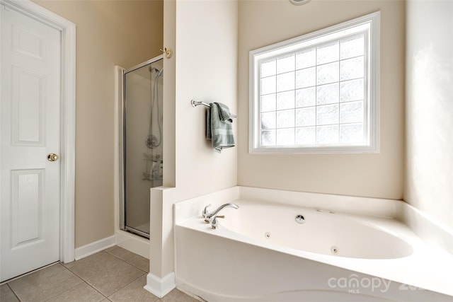 bathroom featuring tile patterned flooring and shower with separate bathtub