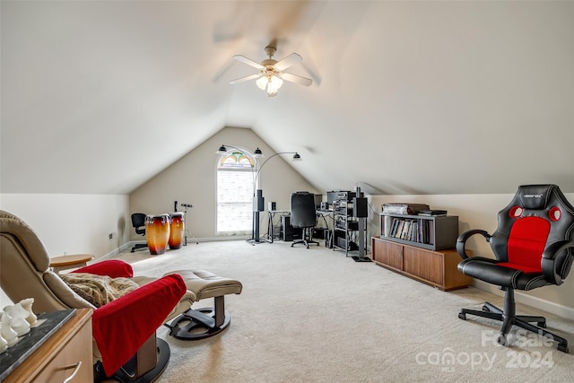 office area featuring ceiling fan, carpet, and vaulted ceiling