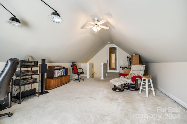 interior space with ceiling fan, carpet flooring, and lofted ceiling