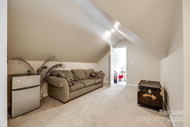 carpeted living room featuring vaulted ceiling