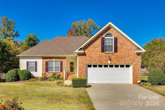 front facade featuring a front yard and a garage