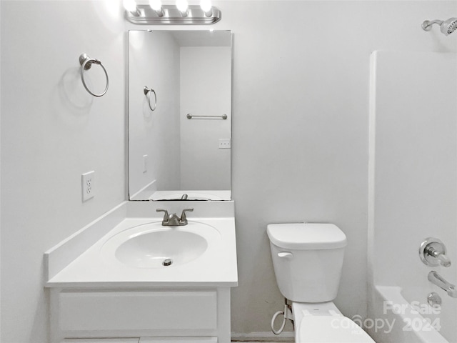 full bathroom featuring vanity, toilet, and washtub / shower combination