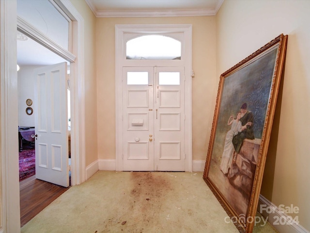 foyer entrance featuring crown molding and wood-type flooring