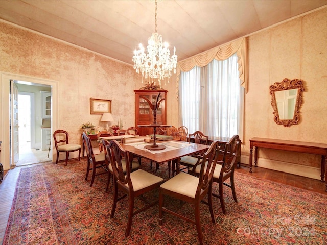 dining room with a notable chandelier and hardwood / wood-style flooring