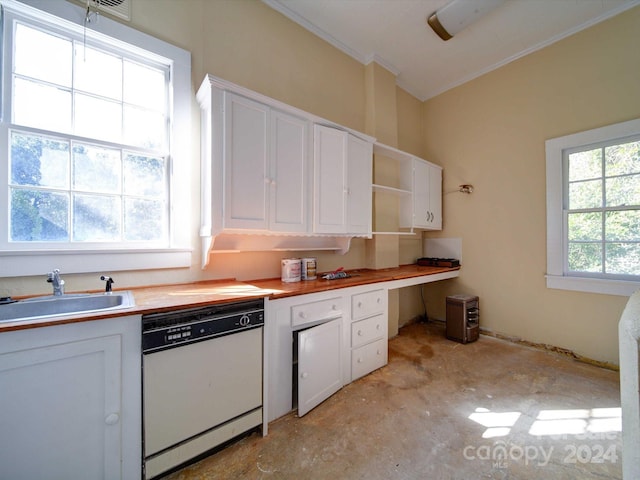 kitchen with dishwasher, white cabinets, wood counters, and sink