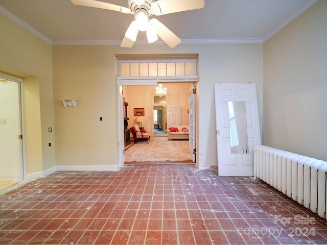 empty room with radiator, crown molding, and ceiling fan with notable chandelier