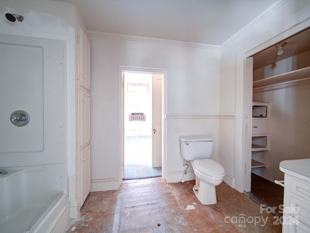 bathroom with vanity, crown molding, toilet, and walk in shower