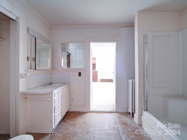 bathroom with vanity, ornamental molding, and radiator