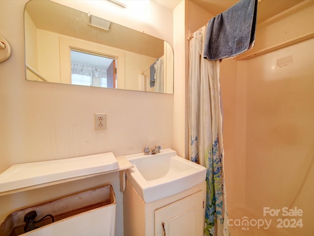 bathroom featuring vanity and a shower with curtain