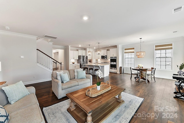 living room featuring crown molding, dark hardwood / wood-style flooring, and sink